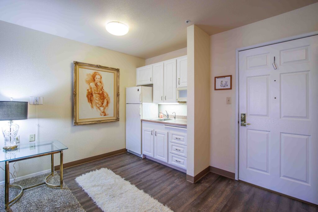 Interior image of a resident's apartment showing a mini kitchenette and dining area.